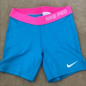 Blue and pink nike pro shorts